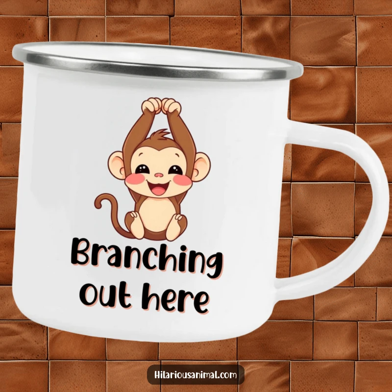 Funny monkey cub enamel camping mug, hanging upside down with a happy chuckle, perfect for outdoor adventures.