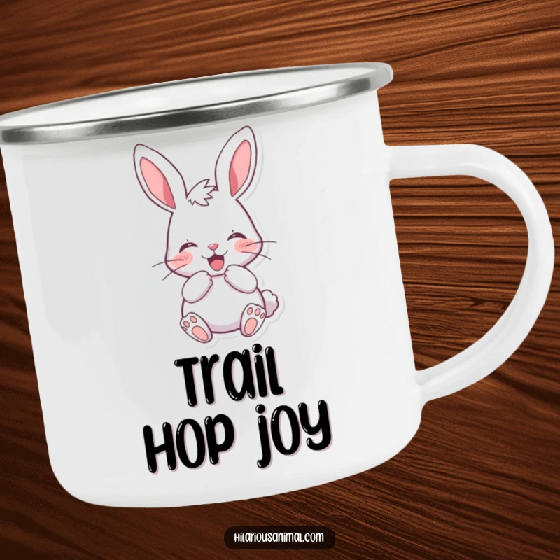 Funny cheerful bunny camping mug featuring a rabbit muffling a laugh behind its paws, ready for campfire stories and chuckles.