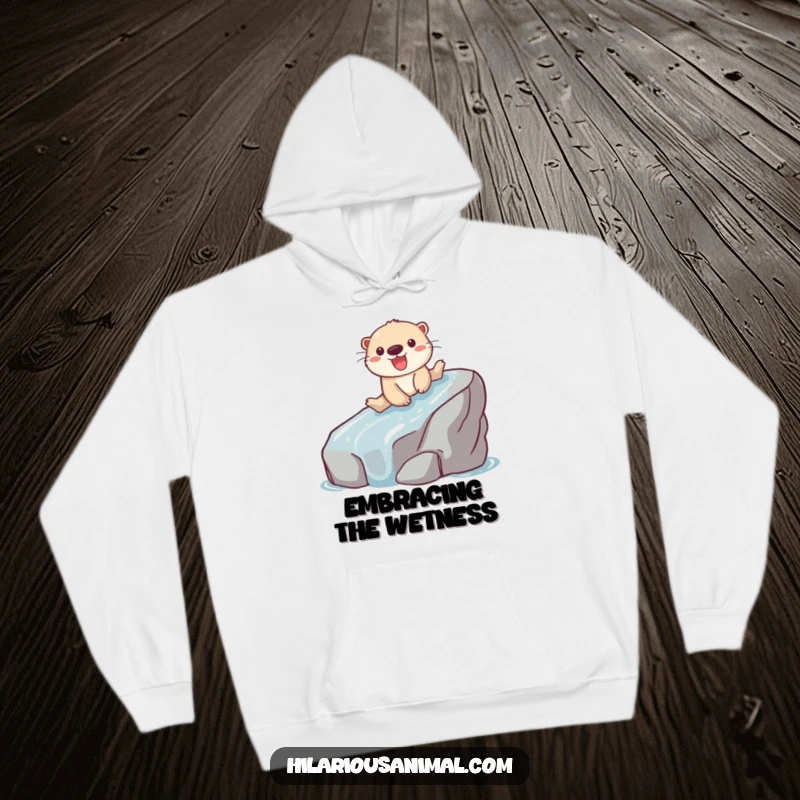 Funny hoodie featuring a playful otter sliding down a slippery rock with a look of pure glee.
