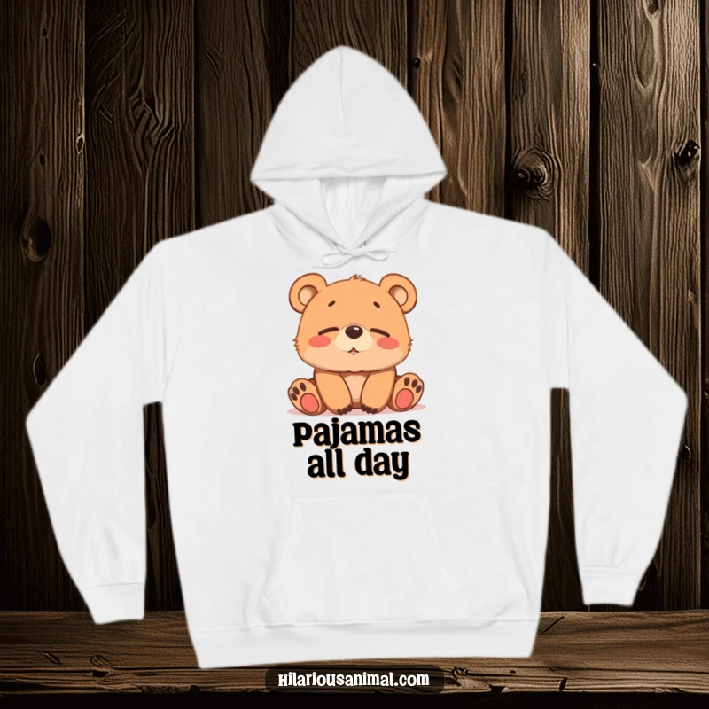 Funny brown bear cub hoodie, softly chuckling with sleepy eyes, offering warmth and gentle humor.