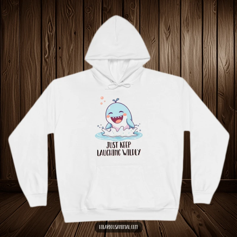 Funny hoodie depicting a happy whale breaching the ocean waves, bursting into a loud, cheerful laugh.