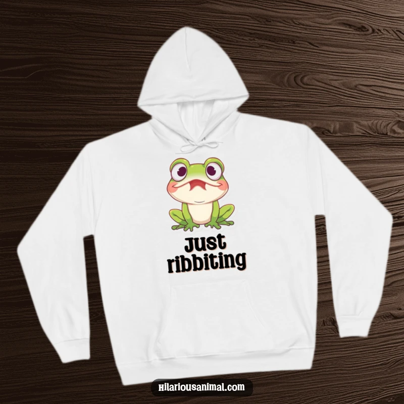 Funny amused frog hoodie, a frog with wide eyes caught in a fit of mirth, cozy and full of amphibian humor