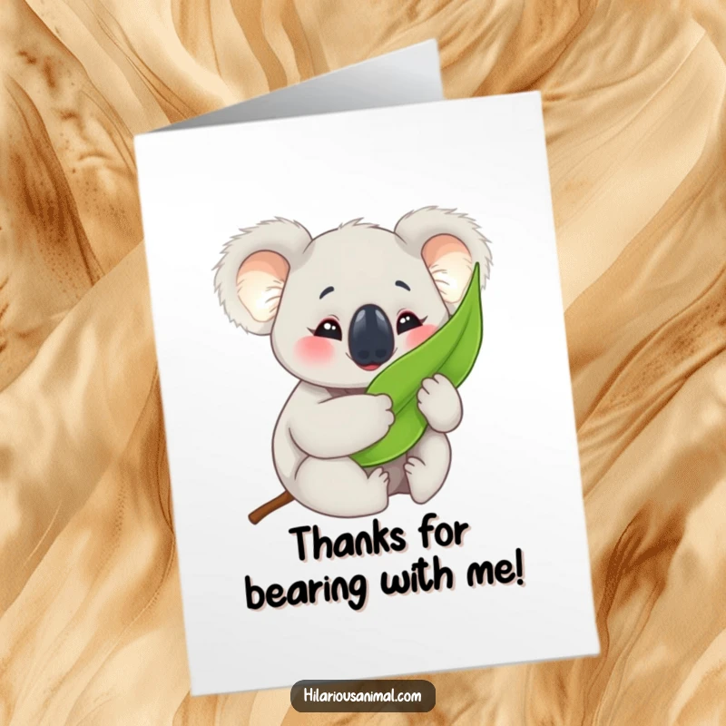 Funny Free Printable Thank You Card: A happy koala cub hugging a eucalyptus leaf, eyes crinkled, sending warm and fuzzy thanks.